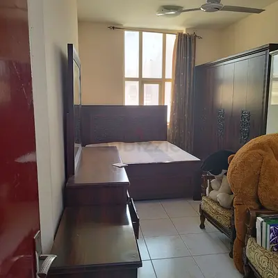 Complete Wooden Bedroom Set including Bed, Wardrobe, and Dresser