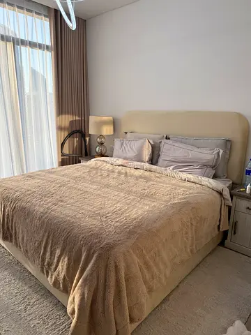 Queen-size upholstered bed frame with headboard in beige