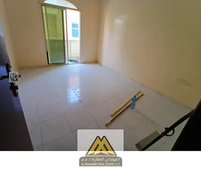 Annual rent: 2-bedroom apartment in Al Mowaihat 3, separate living room, balcony, 2 bathrooms, near