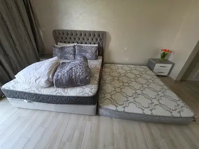 Queen size upholstered bed frame with two mattresses and two side tables - excellent condition