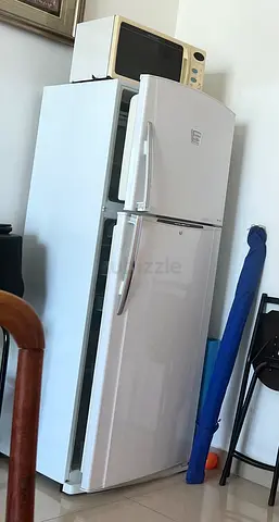 White Double-Door Refrigerator with Top Freezer - less cooling down part.