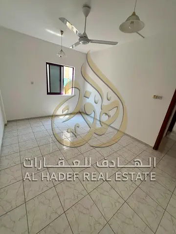 **The Finest 1-Bedroom Apartment with Living Room in Al Bu Tina, featuring an excellent spacious layout. Prime location close to all essential service
