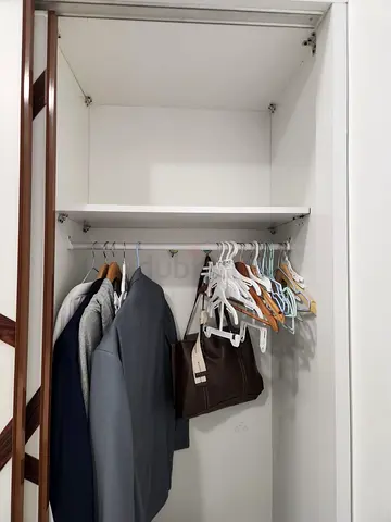 White single-door wardrobe with hanging rail and shelf - good condition