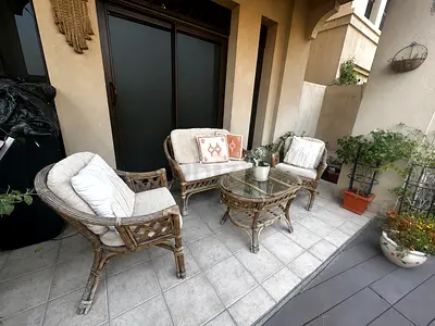 3-piece rattan patio seating set with glass coffee table - good condition
