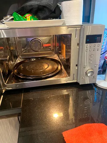Used stainless steel microwave oven - good working condition