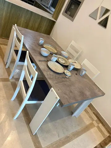 Modern rectangular dining table with 4 white chairs - good condition