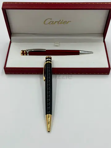 Cartier ballpoint pen and matching red twist pen in original box