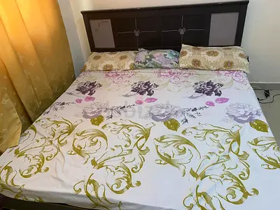 King size bed with mattress and pillows
