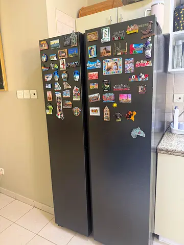 Well-maintained double-door refrigerator (side-by-side style) - dark stainless finish