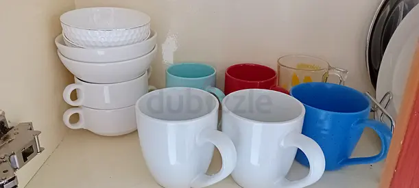 Set of assorted mugs and bowls — used kitchenware, good condition