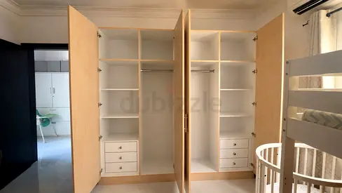 Light wood built-in wardrobe with drawers and hanging rails - good condition