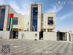 For rent: villa in Al Helio 2 Ajman, 2 floors and roof, majlis, 2 living rooms, 6 master bedrooms, b