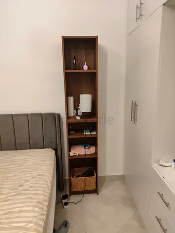 Slim tall wooden shelving unit — excellent condition, sold separately