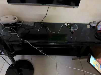 Black glossy TV stand / entertainment unit - 2 shelves, good condition