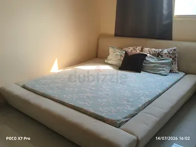White King Size Bed.Low clearance. Storage compartment below mattress