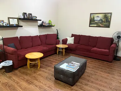 Two Red 3-Seater Sofas in Good Condition - Comfortable Living Room Set with coffee table and 2 side