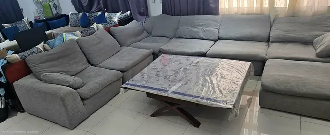 Large feather L-shaped grey fabric sectional sofa with ottoman