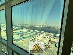 Two bedrooms and a living room, furnished and with parking, in the Orient Towers, Al Bustan area, cl