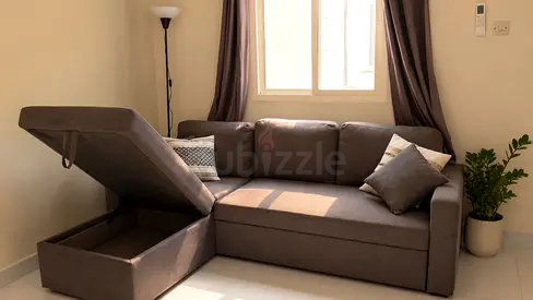 3-seater storage sofa bed in grey — good condition