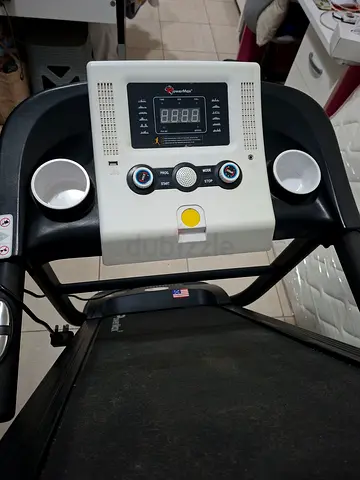 Power Max Used electric treadmill with basic console and cup holders good condition