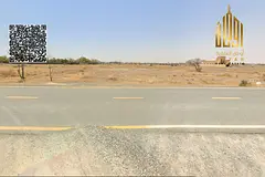 Commercial land Manama 8 area close to the road.