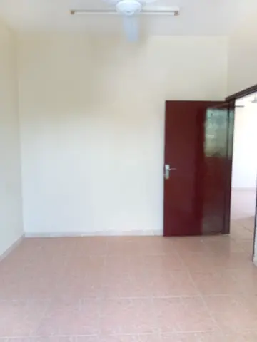 For rent in Al Nuaimiya 2, Ajman: 2-bedroom apartment with living room, kitchen, bathroom, balcony, split AC. AED 28,000/year, 6 payments, deposit by