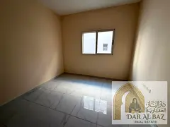 Upscale two-bedroom apartment with a spacious living room for annual rent in the Muwailih area, feat