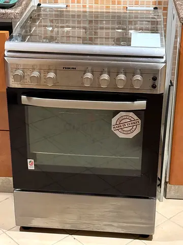 Used 4 burner Nikai gas oven and - under warranty only used for 6 months