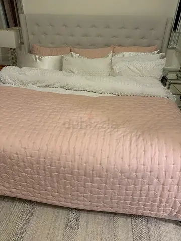 Super king bed with tufted headboard