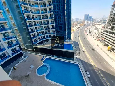 For annual rent in Ajman, in Al Waha Towers: two bedrooms, a living room, three bathrooms, large spaces.