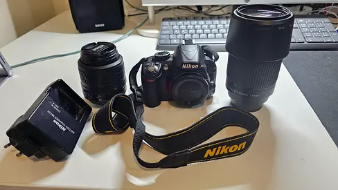 Nikon D3100 DSLR + 18–55mm VR 70–300mm Lens + Memory Card