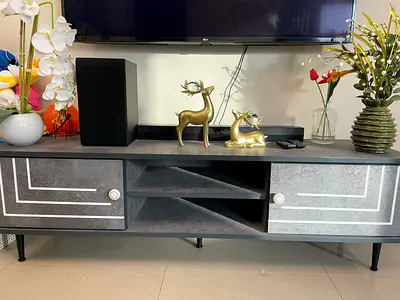 Modern low TV cabinet / entertainment console in grey with storage