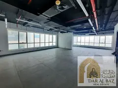 Office for annual rent in Al Majaz 2, large area, includes 2 bathrooms, semi-divided office in a pre