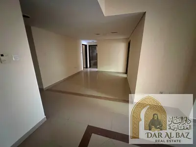 Beautiful three-bedroom apartment for annual rent in Sharjah, Al Taawun area, featuring a spacious living room, master bedroom, three bathrooms, maid'