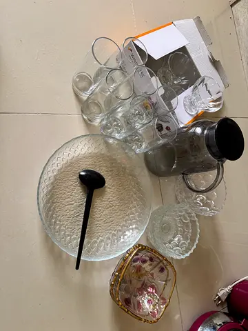 Mixed glassware set — bowls, glasses, jug and serving pieces