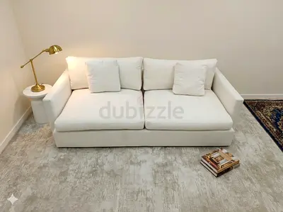 Authentic crate and barrel cream color three seater sofa