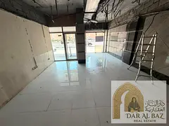 Commercial space for annual rent in Al Nahda | Spacious area | Directly on the main road | Opposite