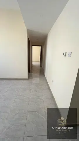 Two‑bedroom apartment in Al Jurf 3 with two bathrooms, parking, flexible payment of 4 or 6 cheques, 5K security cheque, three layouts available, annua