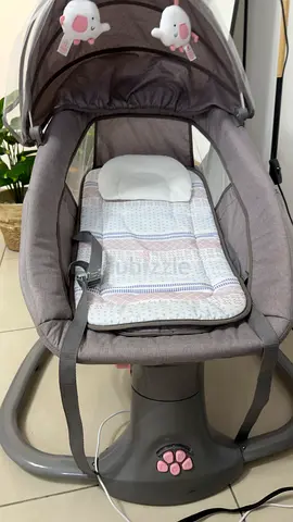 Gray electric baby swing/rocker with canopy and toys - excellent condition