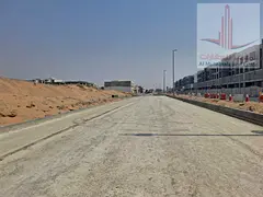 For sale in Sharjah: Residential/commercial land in Al Qasimia - Bushgara. 10,000 sq ft G+3 parking