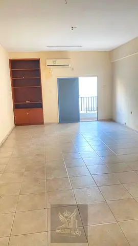 Spacious 2-bedroom + living room apartment in Al Majaz 3 at an unbeatable price; full maintenance covered by the landlord.