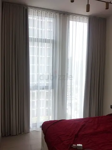 Full-length grey blackout curtains with sheer panels - set for bedroom