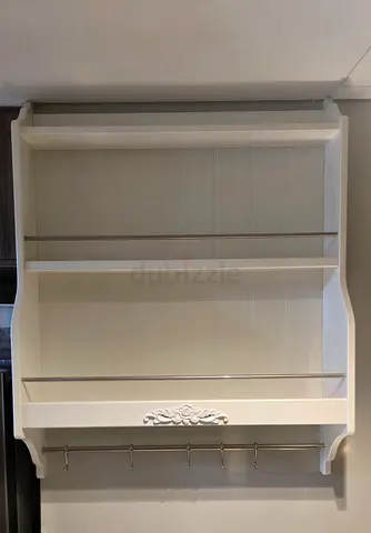 White Wall-Mounted Kitchen Shelf with Hooks and Decorative Trim