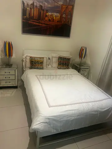 White double bed frame with headboard and matching bedside tables with mattress 180 x200 cm lamps