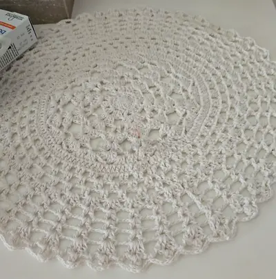Handmade round crocheted doily / table mat - off-white