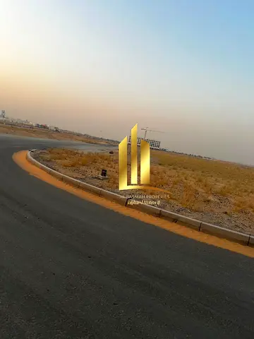 Two residential corner plots for sale in Sharjah, Al Sahma area, freehold, available to all Arab nationalities.