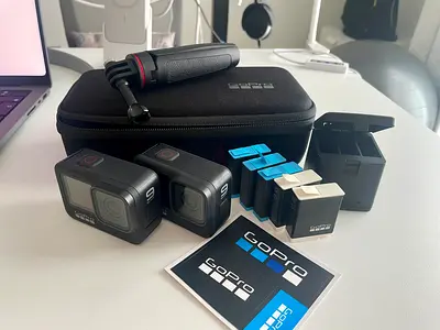 2 X GoPro Hero 9 Black + 5 Batteries + Charger + Hard Case + Tripod
