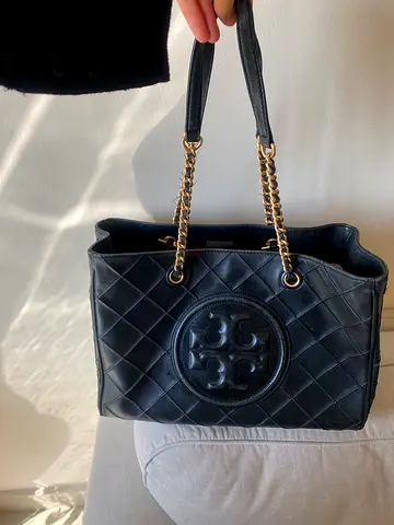Black quilted leather shoulder bag with gold chain straps
