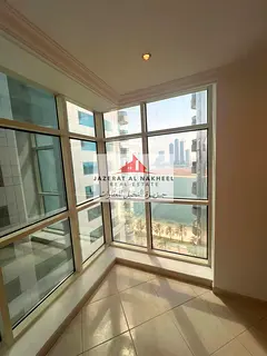 Three-bedroom apartment with a living room for sale in the Al Khan area, Sharjah.