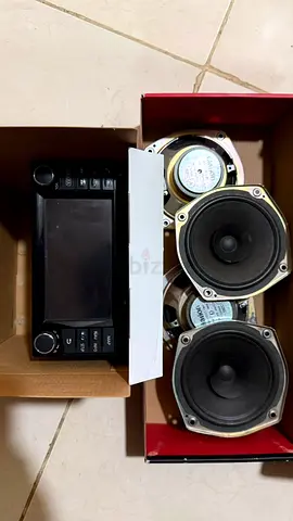 Used Nissan Patrol Safari stock stereo head unit with four speakers